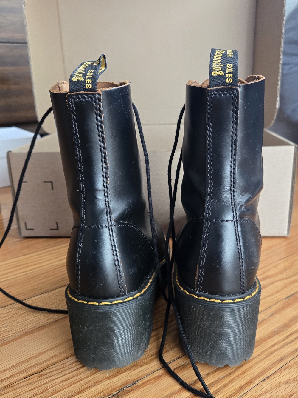 Dr. Martens Leona Black Leather Lug Platform Lace-Up Boots - Picture 2 of 6